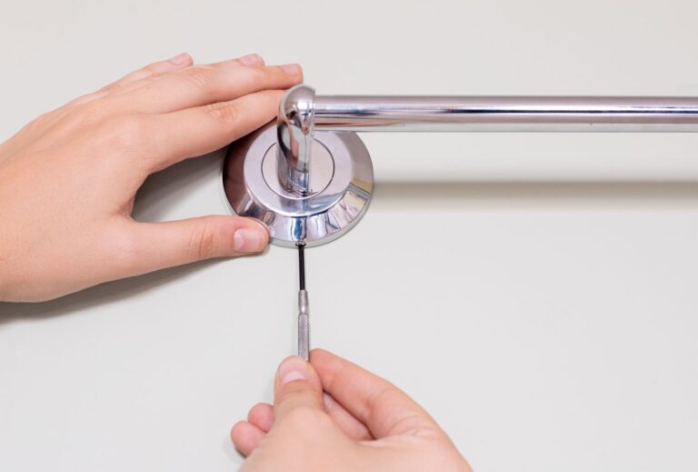 how to remove a towel bar with no visible screws