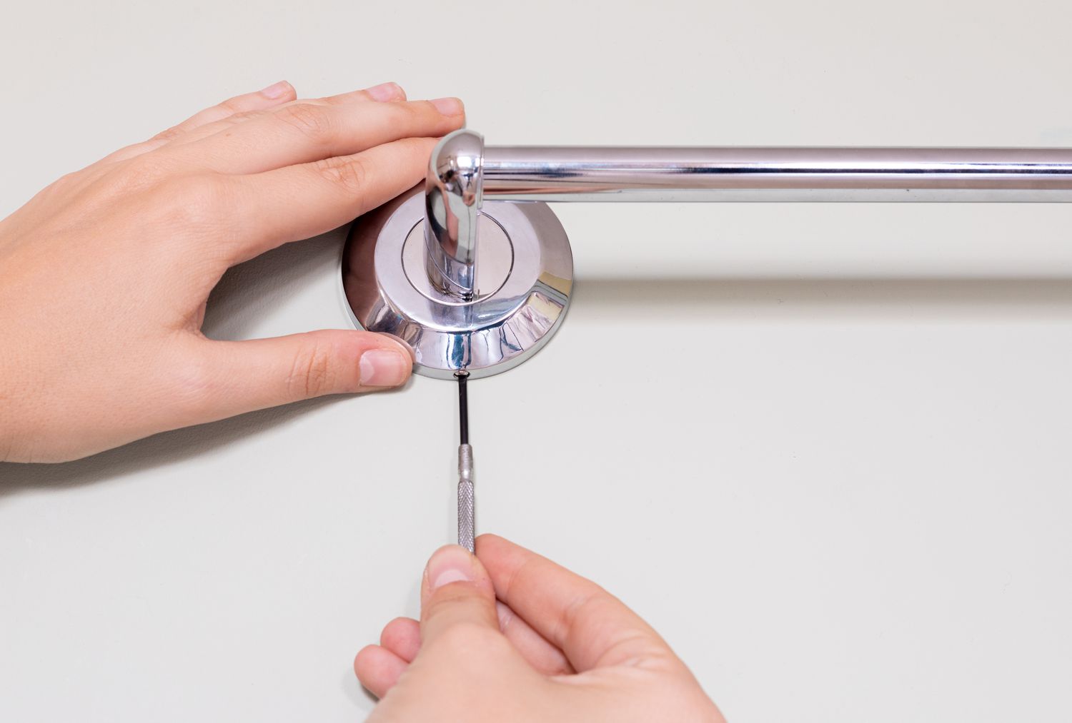 how to remove a towel bar with no visible screws